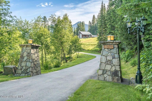 view of gate featuring a mountain view