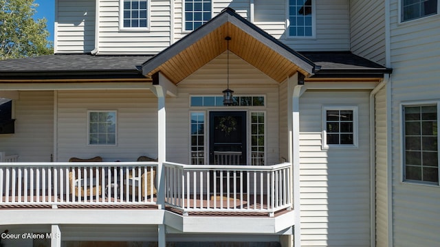 view of exterior entry with covered porch