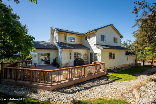 rear view of house featuring a deck