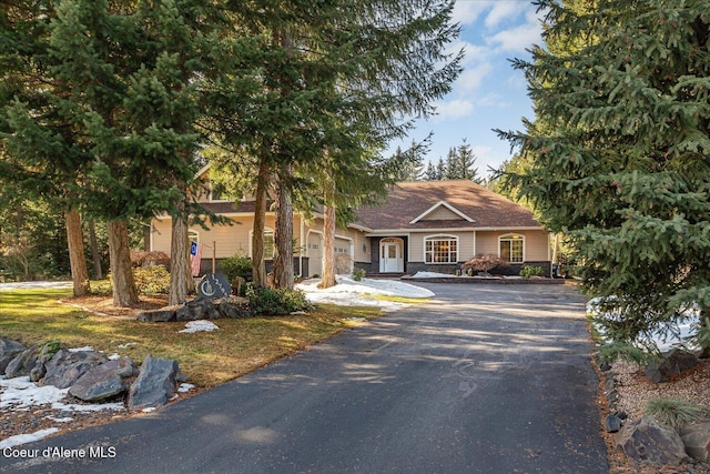 view of front of home featuring driveway and an attached garage