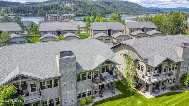 birds eye view of property with a mountain view