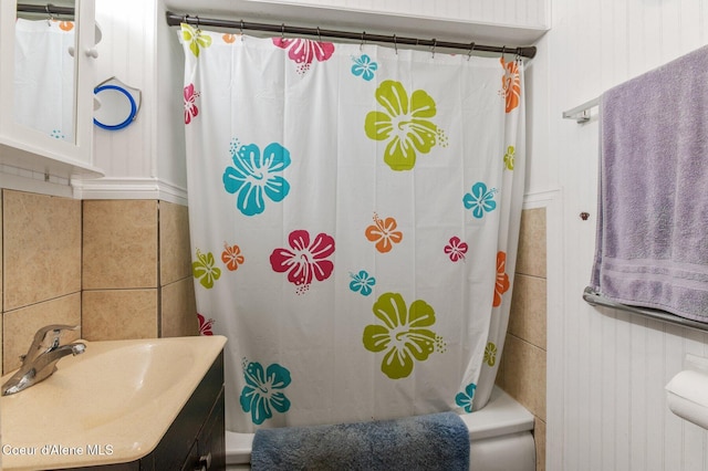 bathroom with shower / bath combination with curtain and vanity