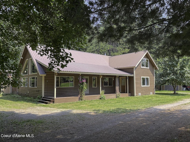 view of front facade with covered porch and a front yard