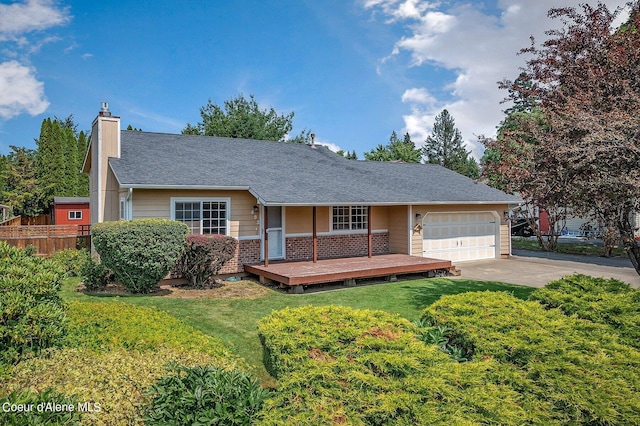 view of front of house featuring a garage and a front yard