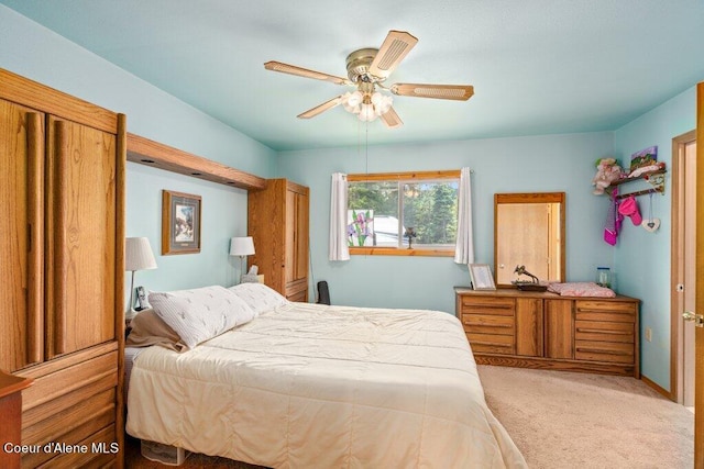 carpeted bedroom with ceiling fan