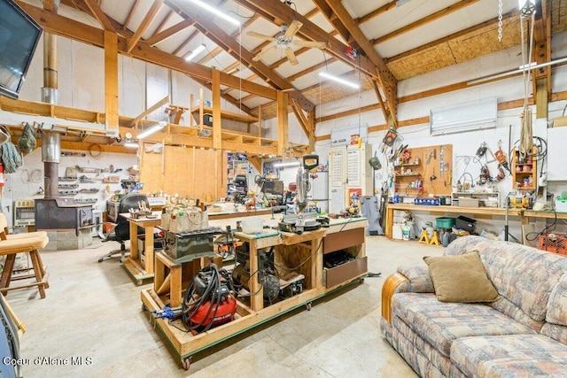 miscellaneous room with high vaulted ceiling, a workshop area, and ceiling fan