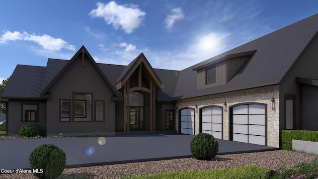 view of front of home featuring stone siding and driveway