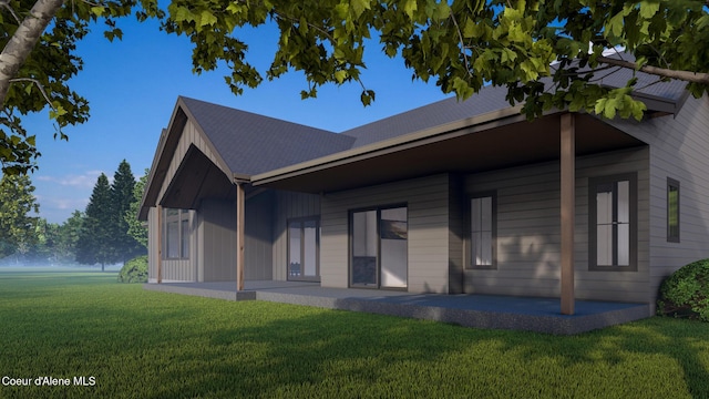 view of front of house with a front yard and a patio area