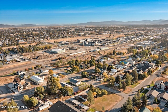 birds eye view of property featuring a mountain view