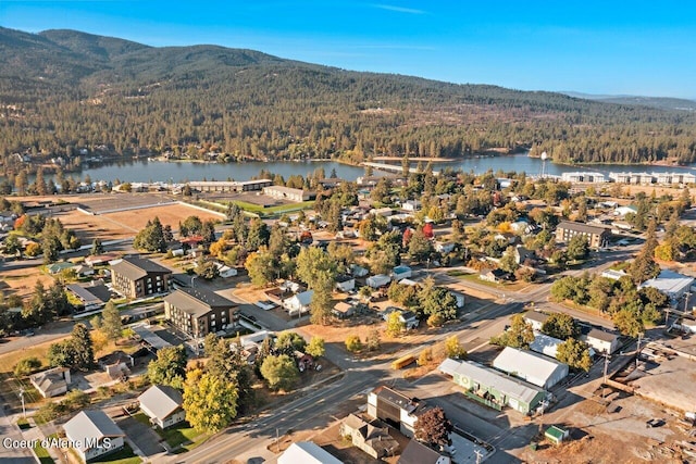 aerial view featuring a water and mountain view