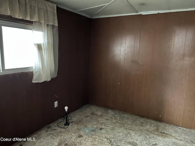 empty room with wood walls