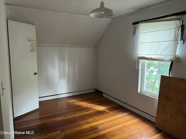 bonus room with hardwood / wood-style floors and lofted ceiling