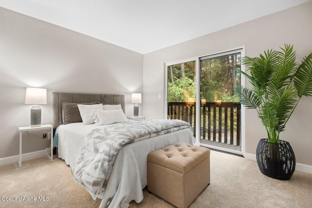 carpeted bedroom featuring access to outside