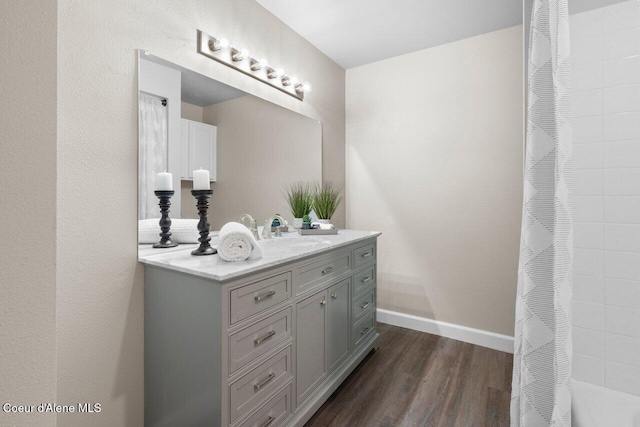 bathroom featuring hardwood / wood-style floors and vanity