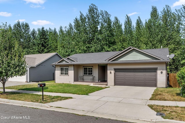 single story home featuring a front lawn and a garage