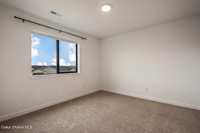 unfurnished room with carpet floors