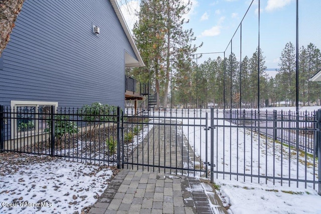 view of snow covered gate