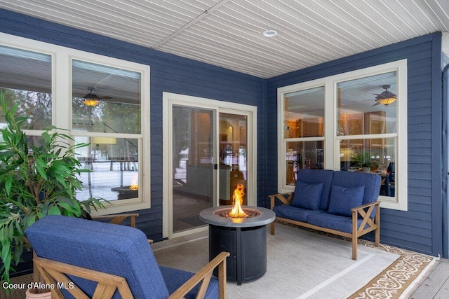 view of patio / terrace featuring an outdoor fire pit