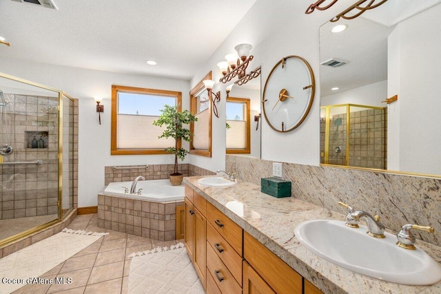 bathroom with tile patterned flooring, plus walk in shower, and vanity