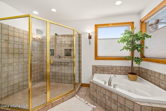 bathroom featuring tile patterned flooring and plus walk in shower