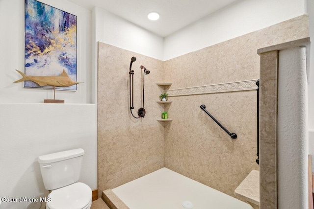 bathroom featuring a shower and toilet