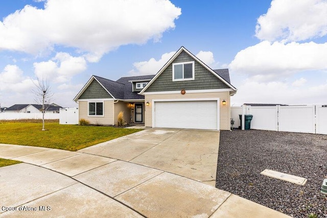 view of front of property featuring a garage and a front yard