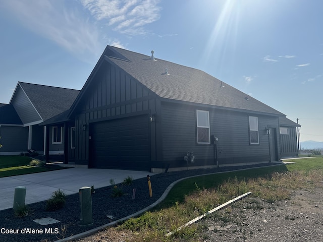 view of side of property featuring a garage