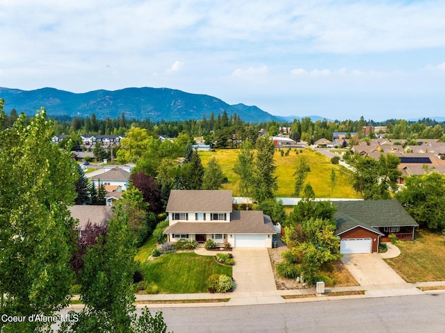 birds eye view of property featuring a mountain view