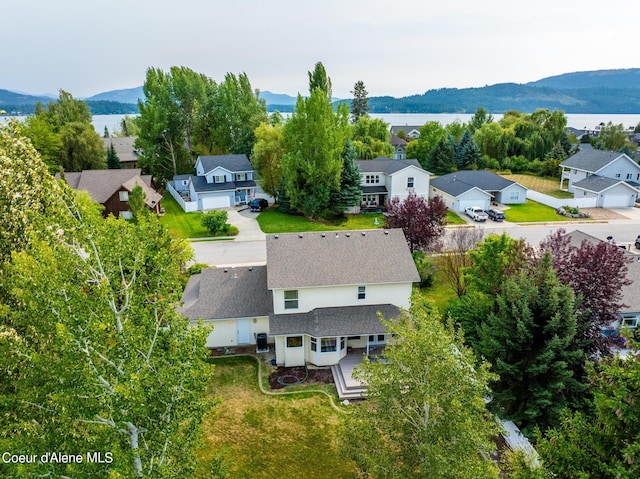 birds eye view of property with a mountain view