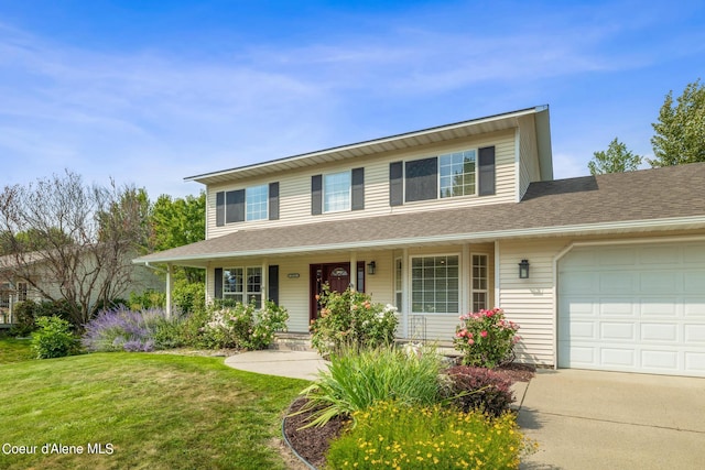 view of front of property with a front lawn and a garage