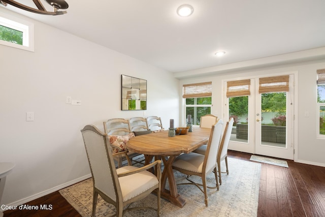 dining space with french doors and dark wood-type flooring