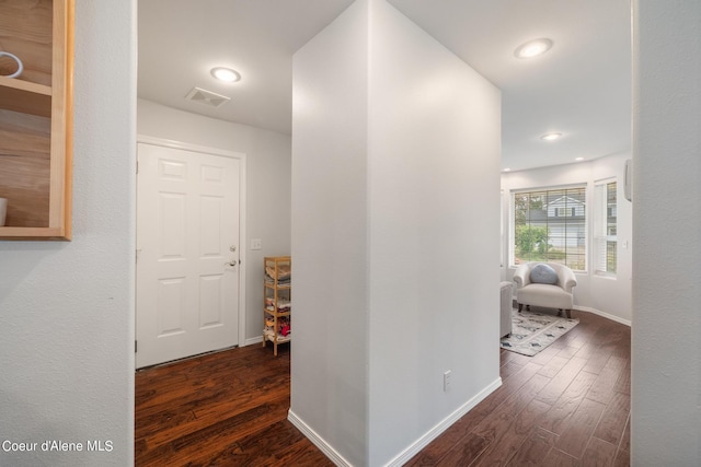 hallway featuring dark wood-type flooring