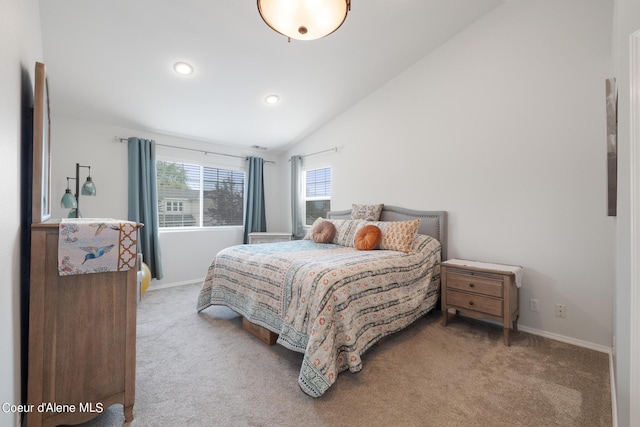 carpeted bedroom with vaulted ceiling