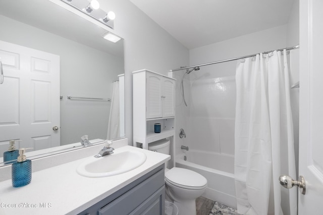 full bathroom featuring vanity, shower / bath combo, and toilet