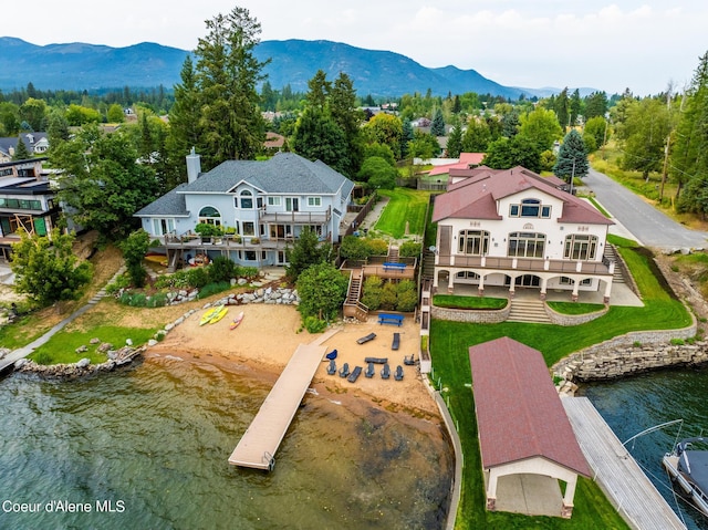 bird's eye view with a water and mountain view