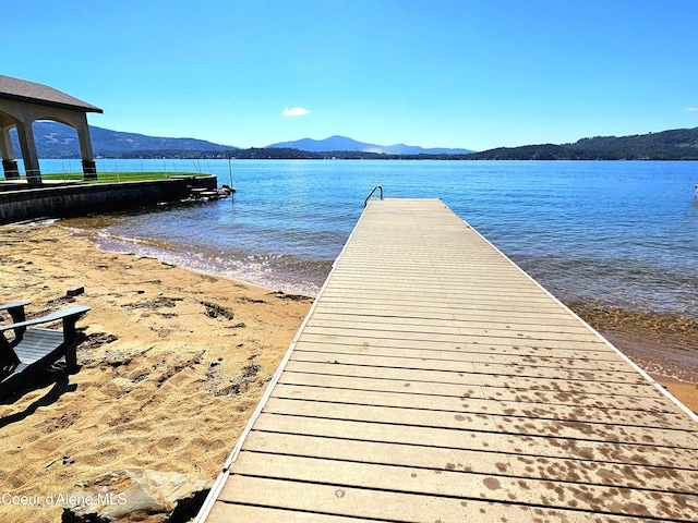 dock area featuring a water and mountain view