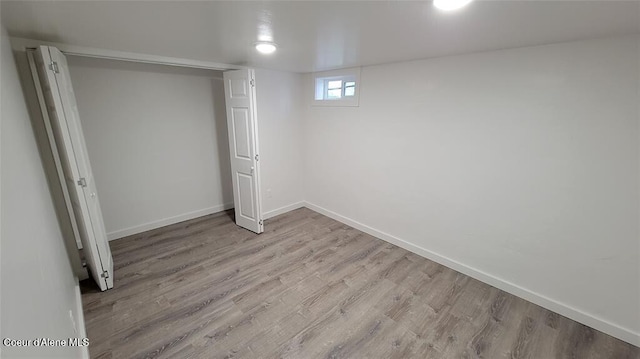 basement featuring light hardwood / wood-style floors