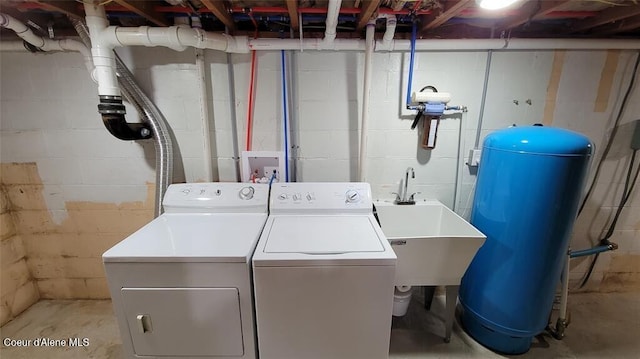 clothes washing area with sink and washing machine and clothes dryer