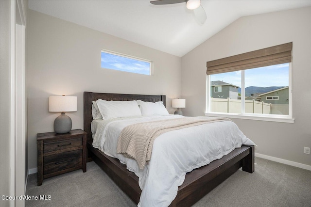 bedroom featuring ceiling fan, light carpet, and vaulted ceiling