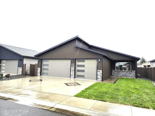 view of front facade with a garage and a front lawn