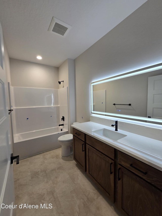 full bathroom featuring vanity, toilet, and washtub / shower combination