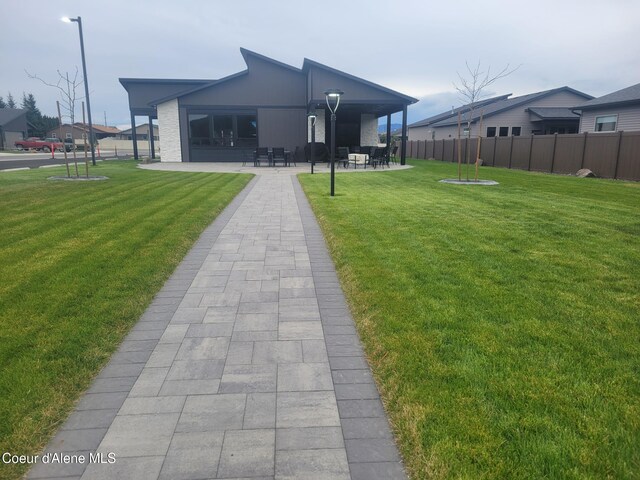 exterior space with a patio area and fence