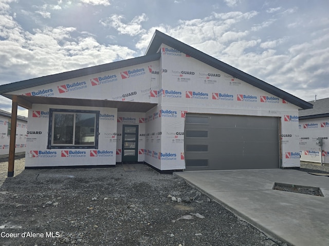 view of front of home featuring a garage and concrete driveway