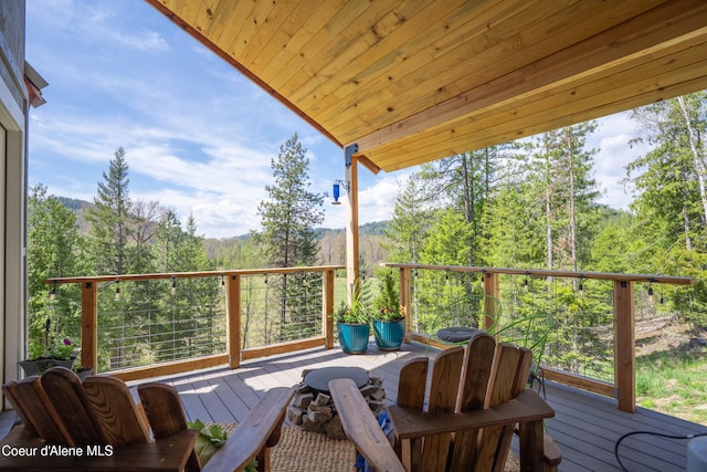 deck featuring a view of trees
