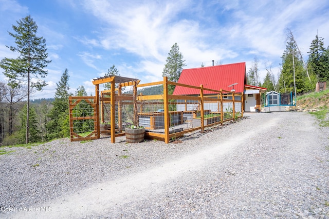 exterior space with gravel driveway