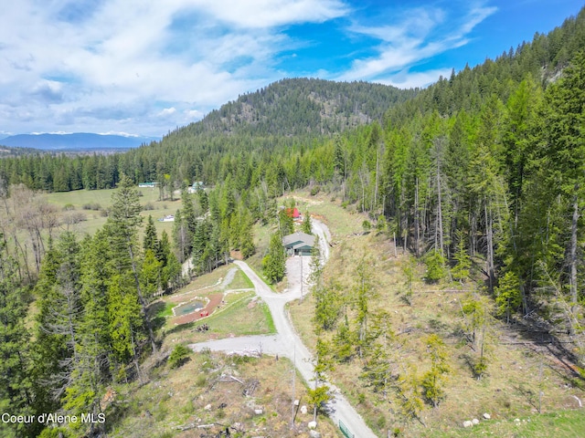 bird's eye view with a view of trees and a mountain view