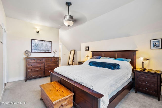 carpeted bedroom with lofted ceiling and ceiling fan