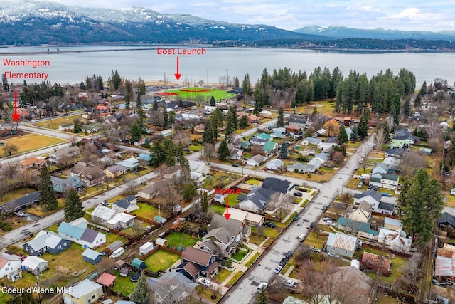 aerial view featuring a water and mountain view