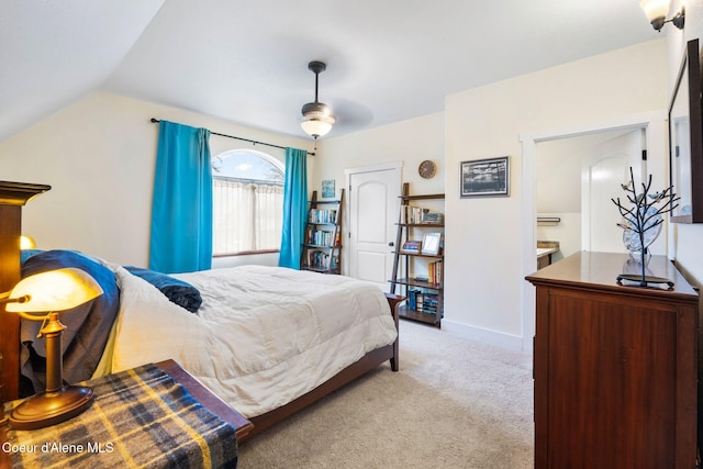 carpeted bedroom featuring ceiling fan and vaulted ceiling