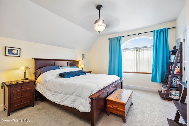 carpeted bedroom featuring vaulted ceiling and ceiling fan